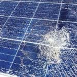 Solar panel with broken glass and damaged solar cells